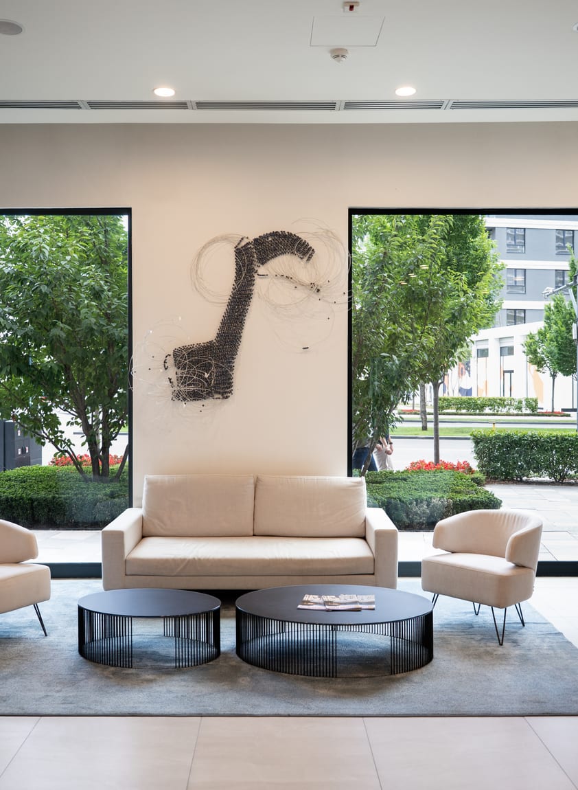 Living area of a Belgrade Waterfront apartment overlooking the greenery of the complex